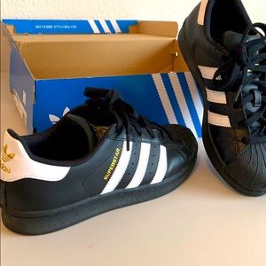Adidas superstar shoes.